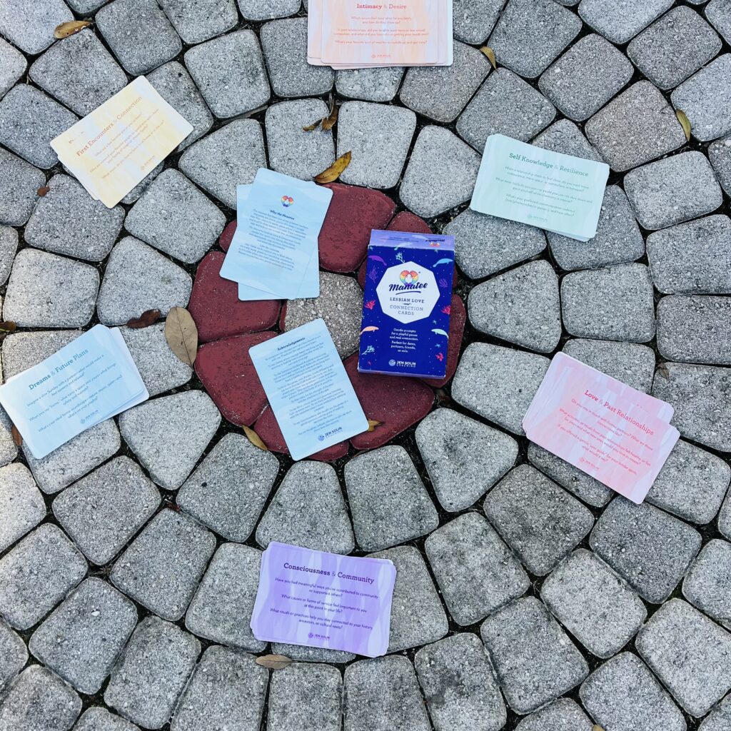 Manatee Cards laid in a circle on cobblestones